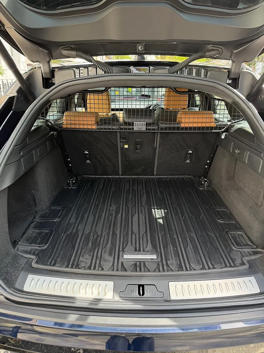 Range Rover Velar boot with a dog guard, vacuumed and wiped clean