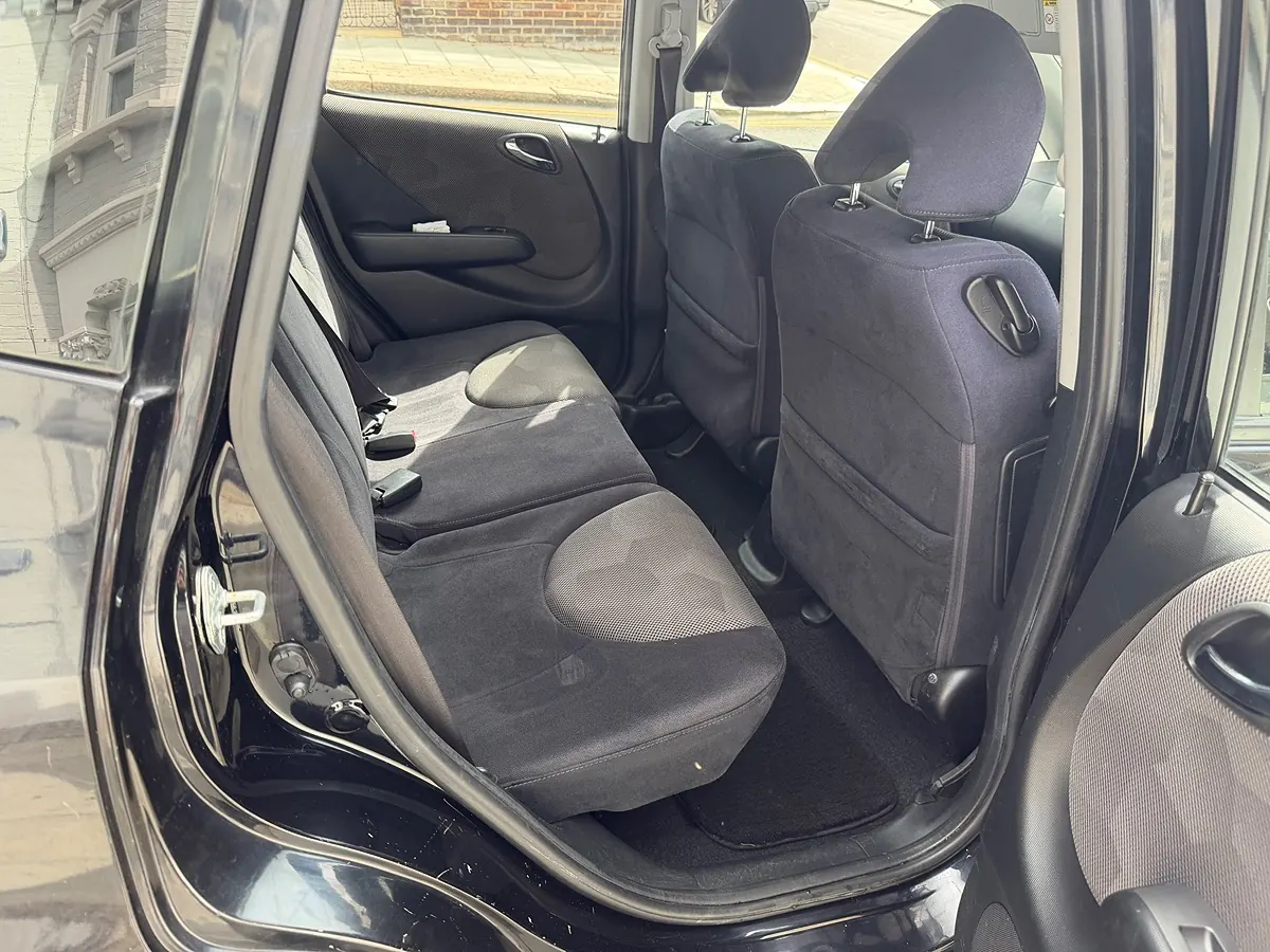 Fabric rear seats and floor vacuumed clean in a family hatchback