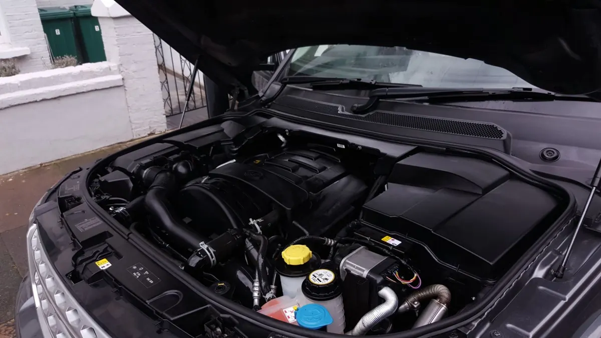 A detailed engine bay on a second car after cleaning