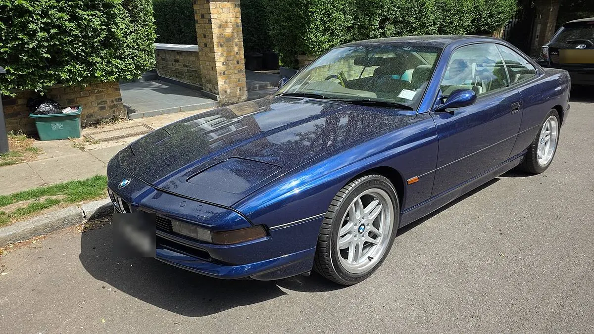 Front three-quarter of a blue BMW 8 Series, freshly washed and waxed