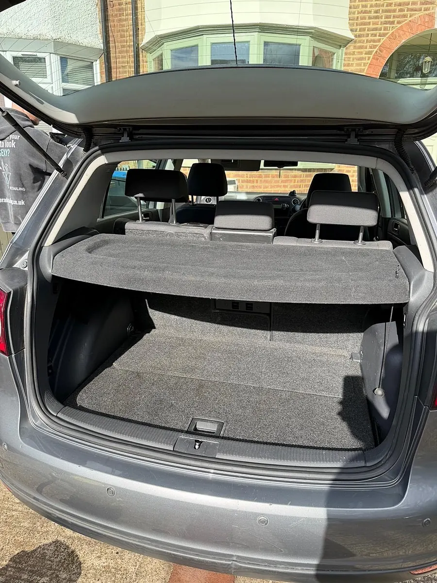 An empty, vacuumed hatchback boot with the parcel shelf in place