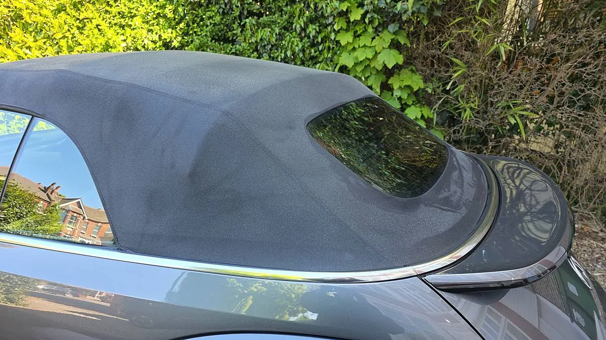 Close view of a cleaned fabric convertible roof and rear window